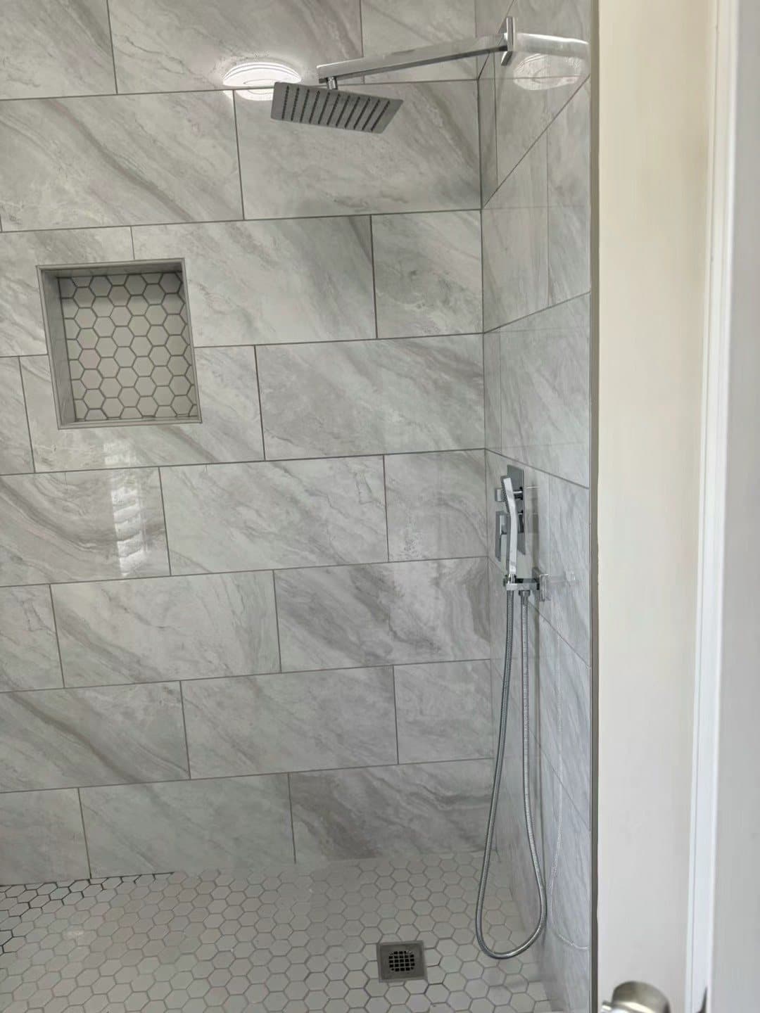 Walk-in shower — hex niche and matching mosaic floor