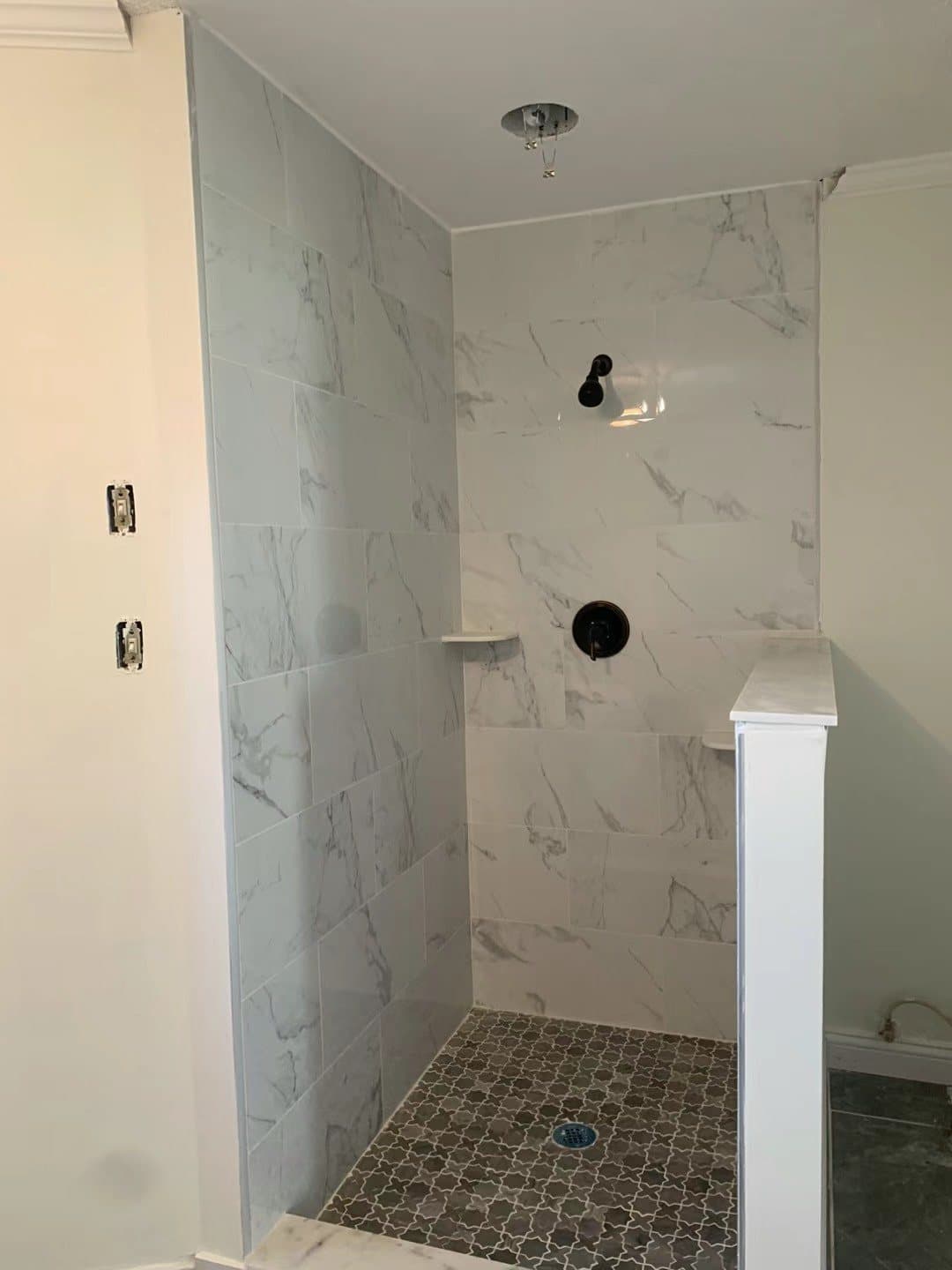 Curbless shower with a pebble floor for grip