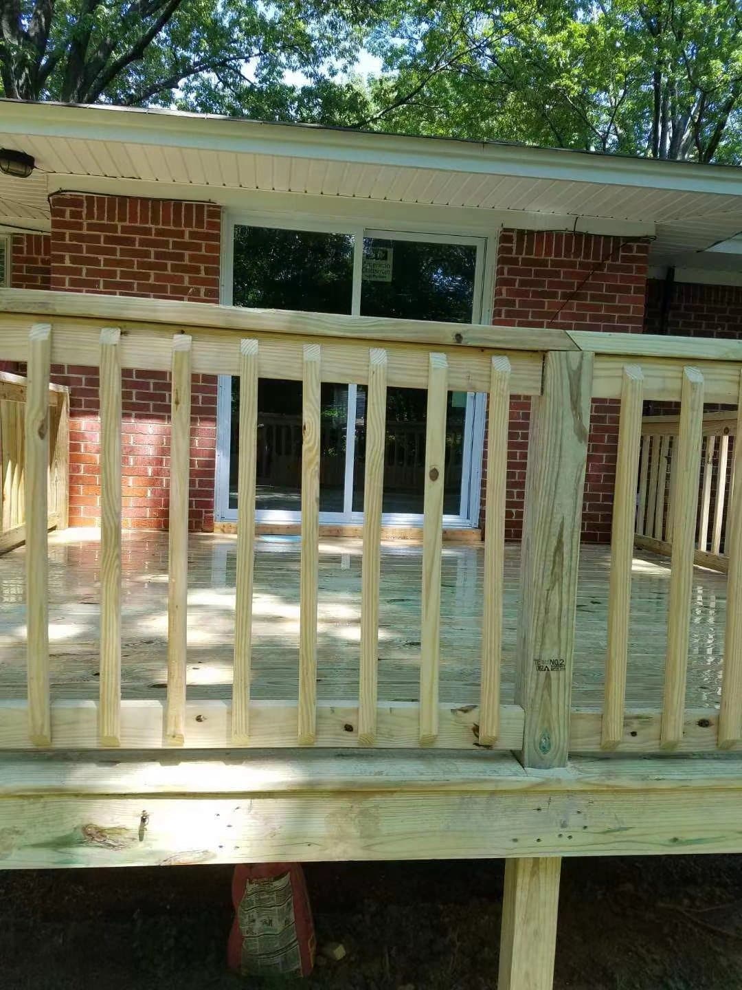 Pressure-treated deck framing and rail posts