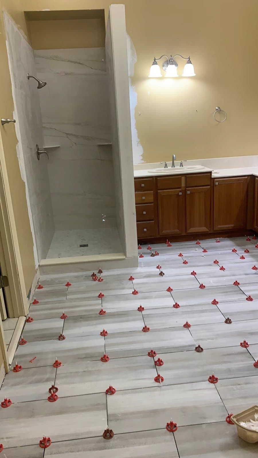 Spacers and clips set before grouting