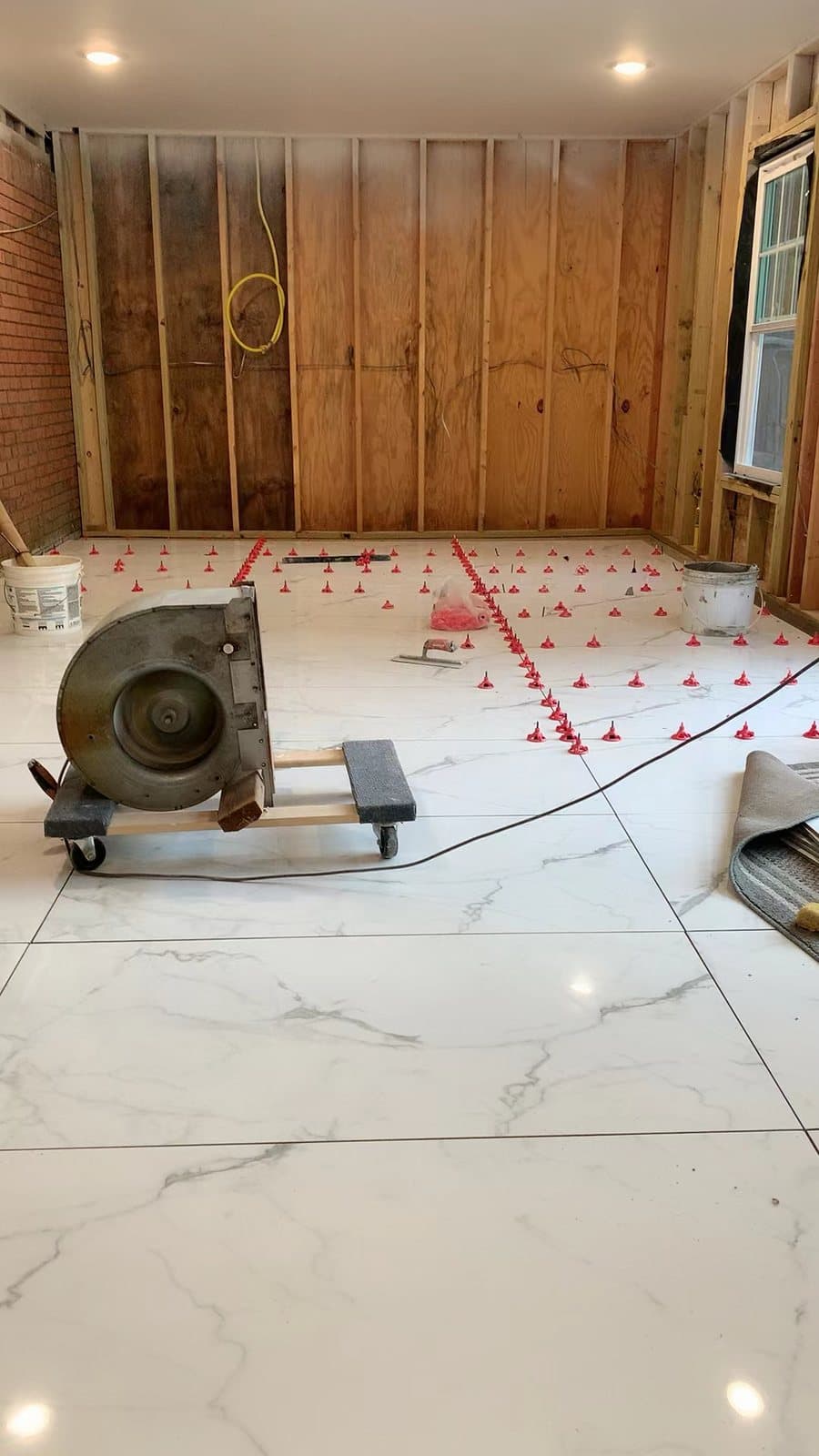 Large-format sheets need two people and a level subfloor